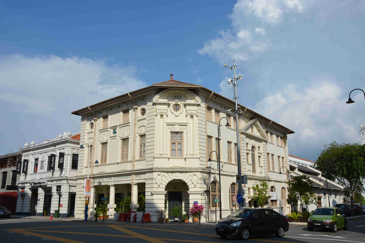 Georgetown Dispensary heritage building in Penang, Malaysia, under blue skies