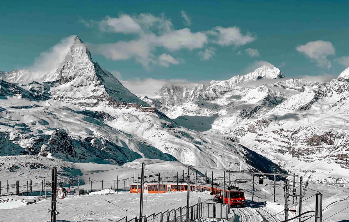 Gornergrat railway with Matterhorn peak in the Swiss Alps during winter.