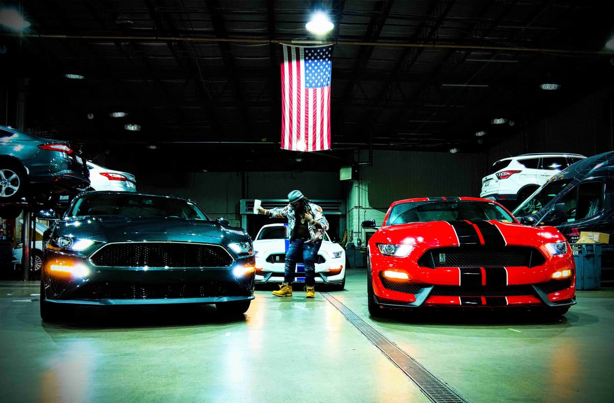 American Muscle Cars in Garage with Flag