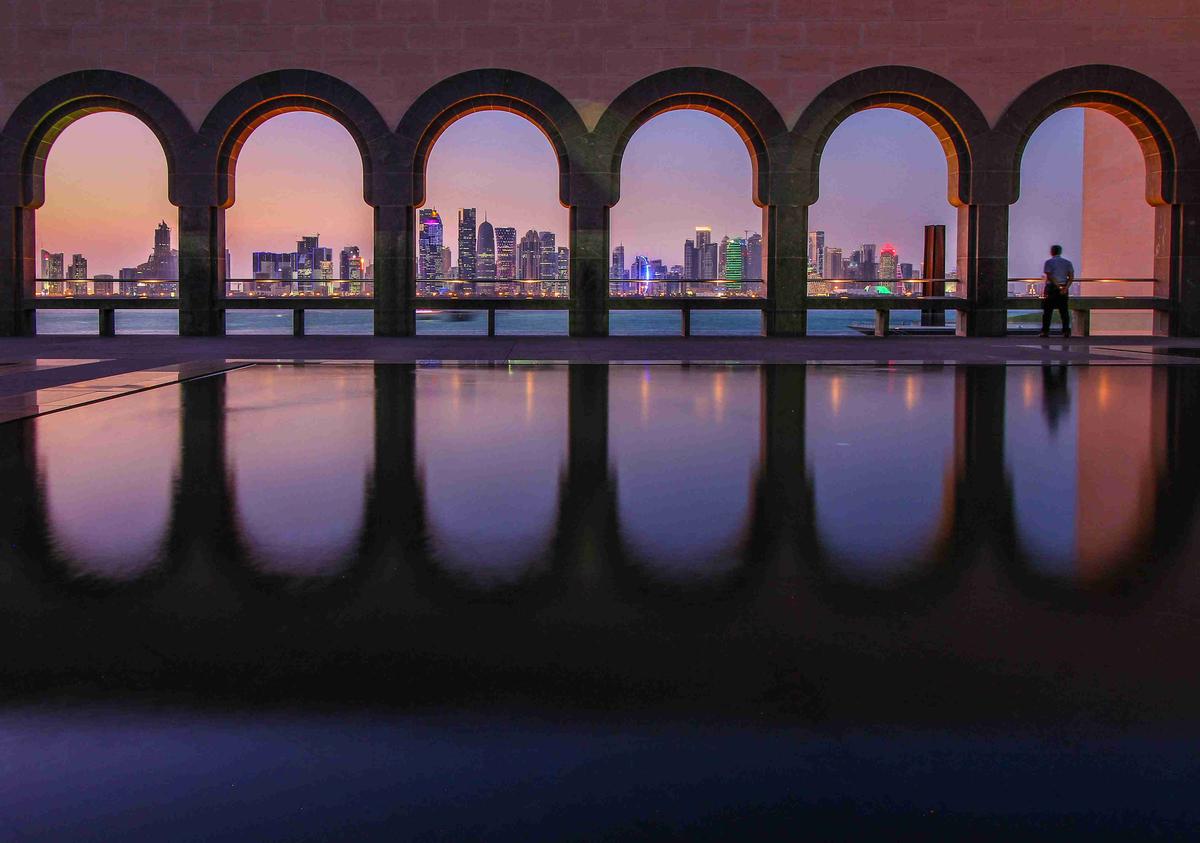 Arched Reflections at Dusk with City Skyline