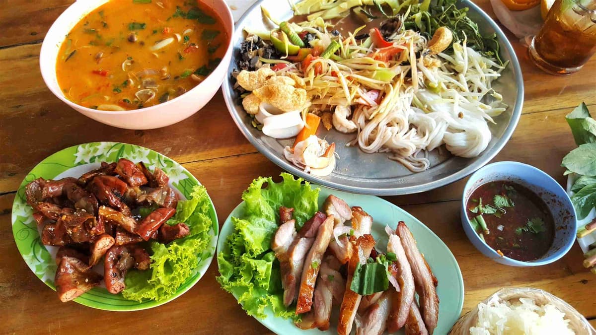 Assorted Thai Dishes on Wooden Table