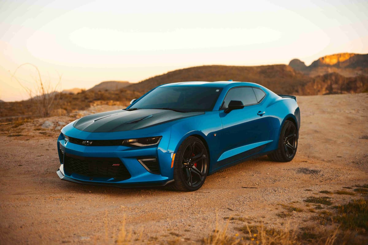 Blue Camaro in Desert Landscape