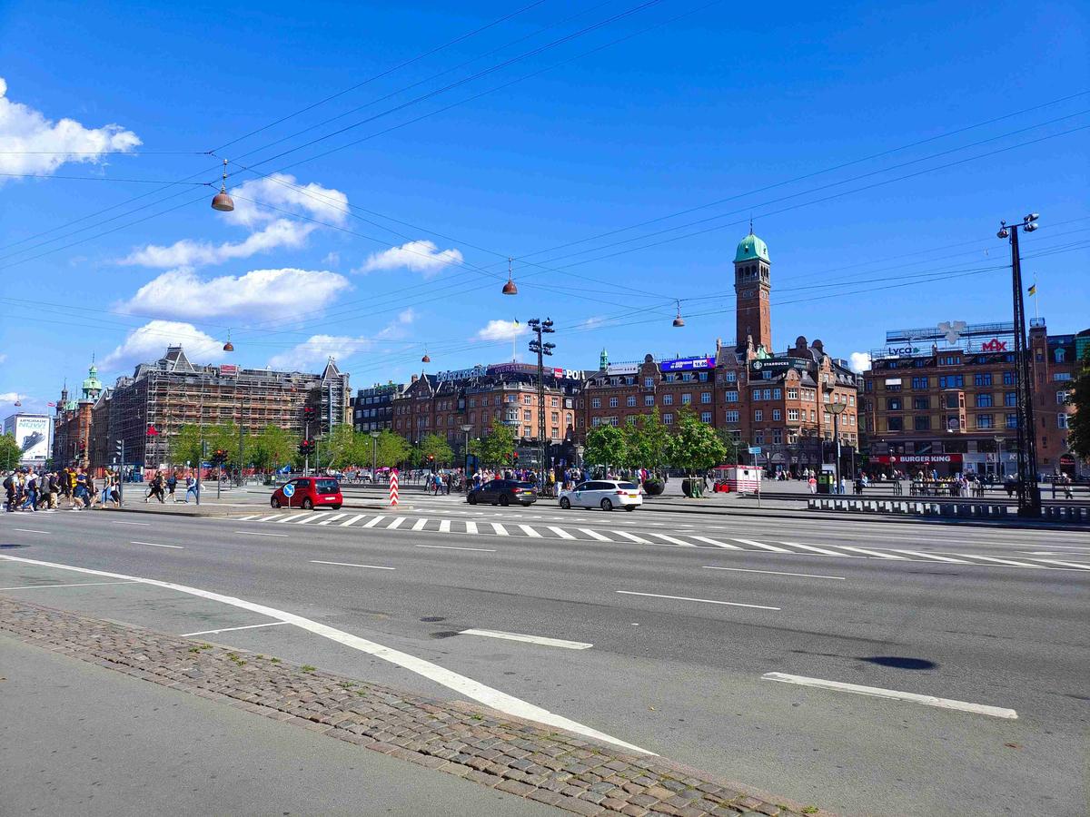 Bustling City Intersection with Sunny Skies