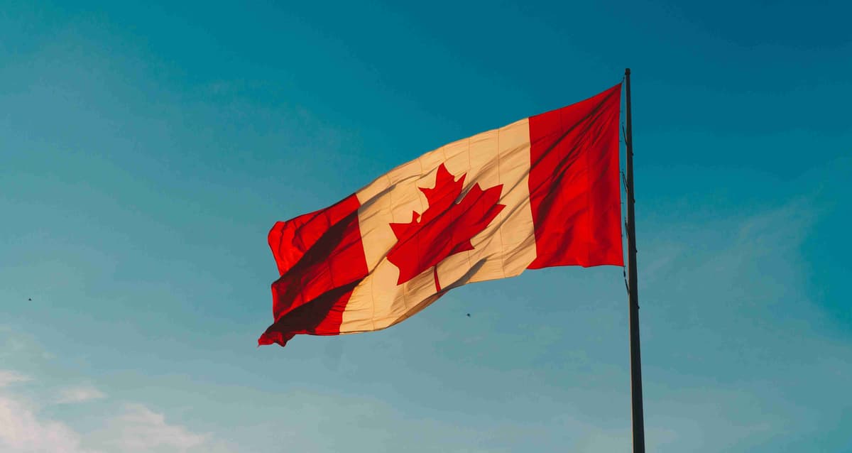 Canadian Flag Against Blue Sky.