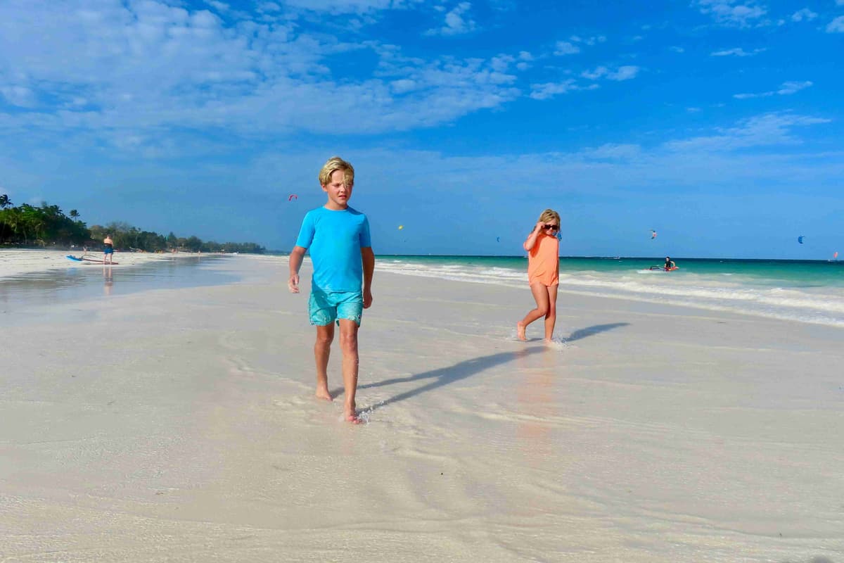 Children Walking on Sunny Beach