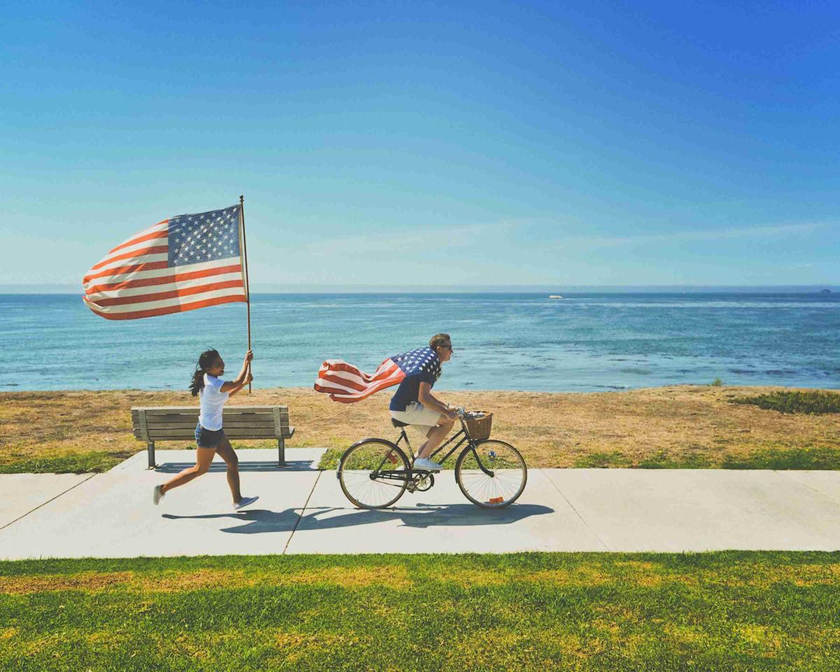 Children and Adult Enjoying the 4th of July at the Beachside Path