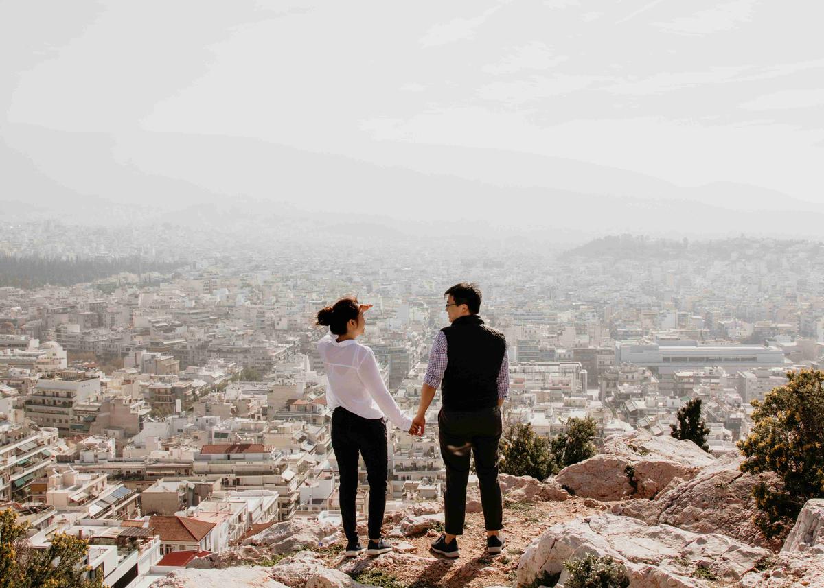 City View From High Ground with Couple Holding Hands
