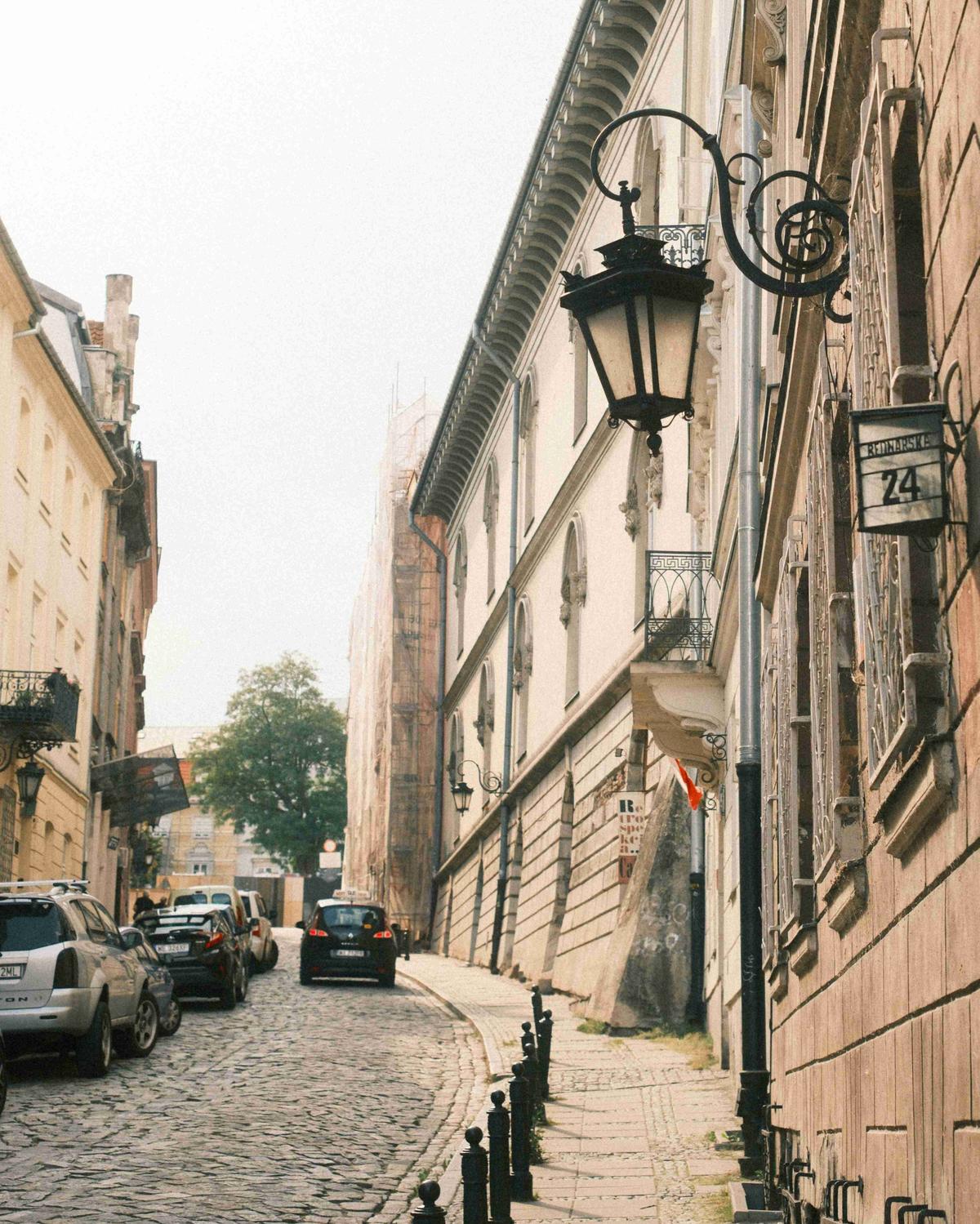 Cobblestone Street with Historic Lamp Posts and Classical Architecture