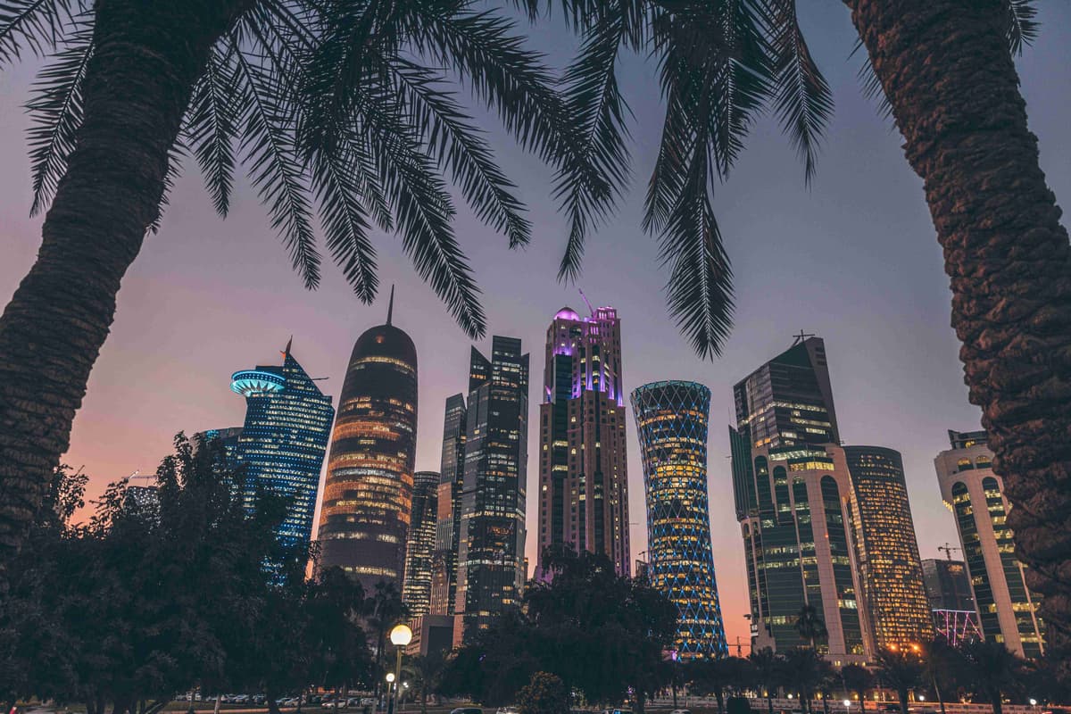 Doha Skyline at Twilight with Palm Silhouettes