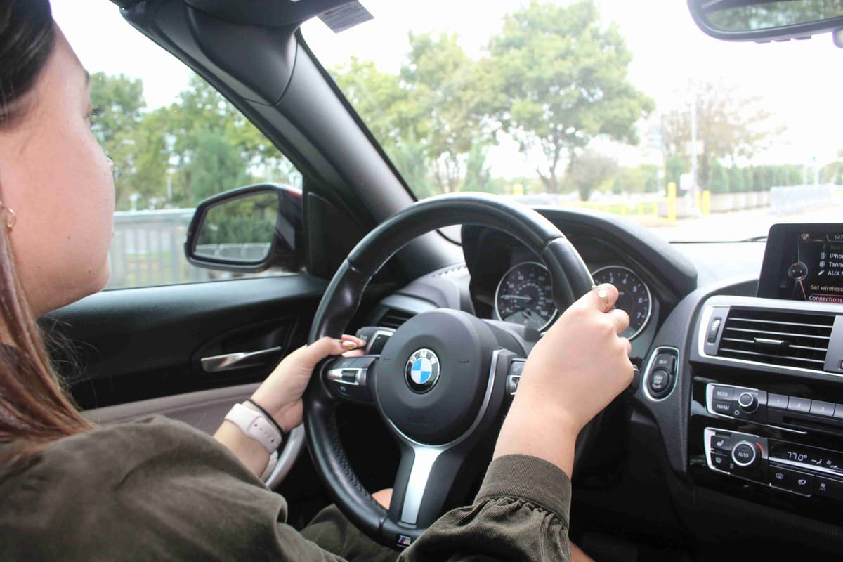 Driver Hands on Steering Wheel of Luxury Car