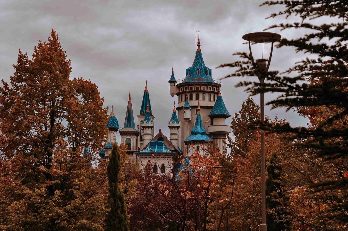 Enchanting Castle Amidst Autumn Foliage