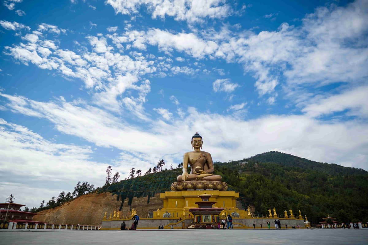 Giant Buddha Statue Under Blue Sky