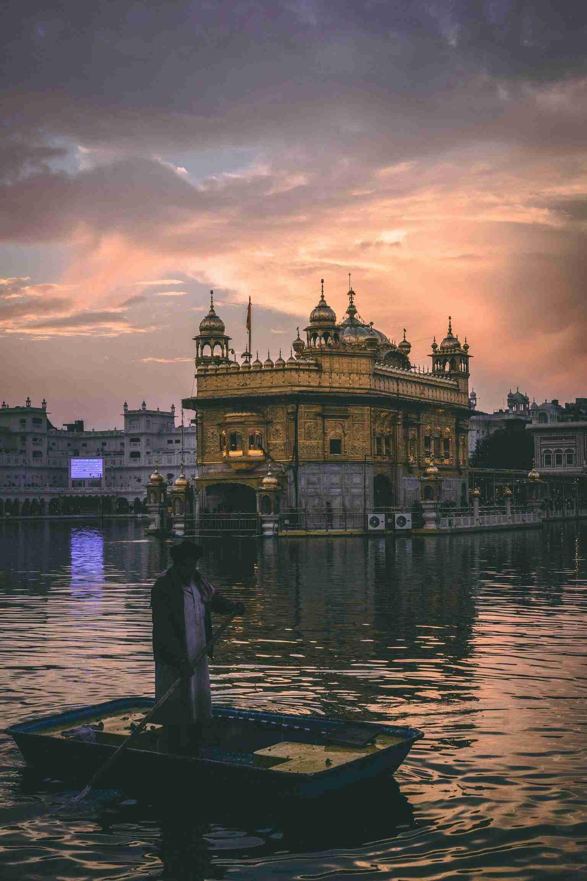 Golden Temple at Sunset with Boatman