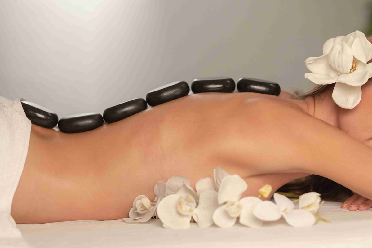 Hot Stone Massage Therapy with Orchids