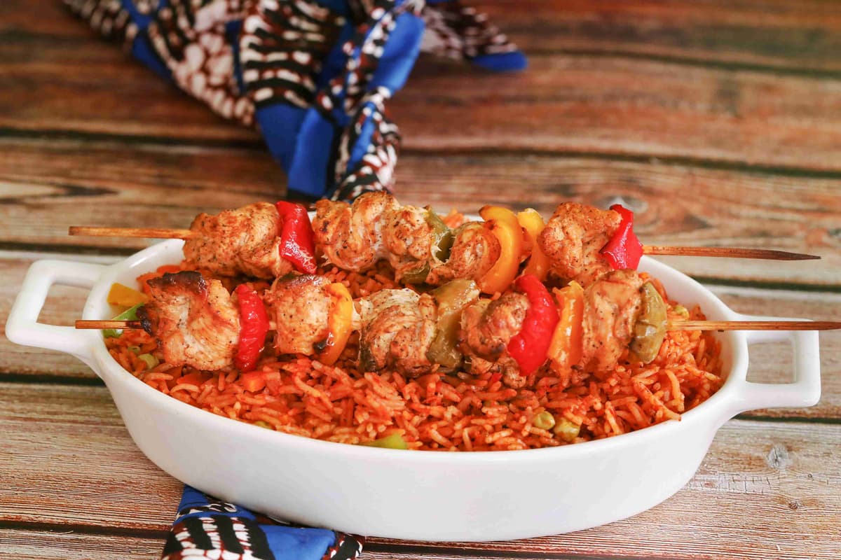 Jollof  Rice with Chicken Kebabs in Serving Dish