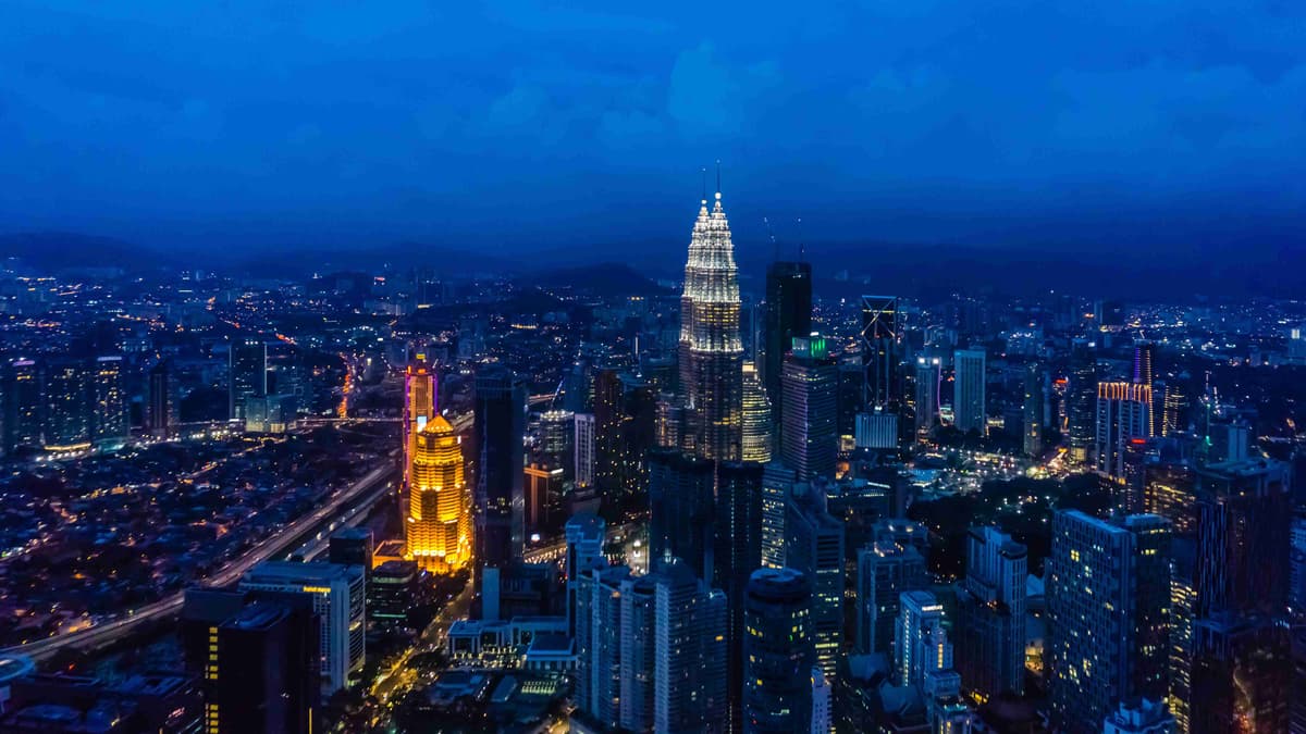 Kuala Lumpur Cityscape at Night with Illuminated Skyscrapers