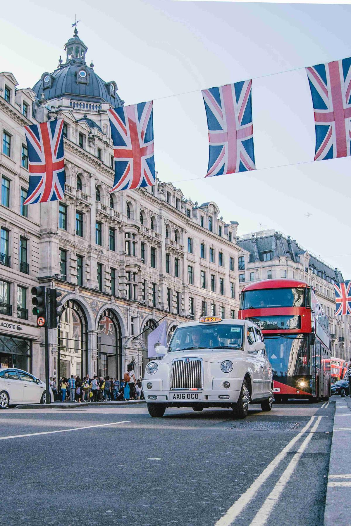 London Street Scene with Bus Taxi and Union Jack Flags