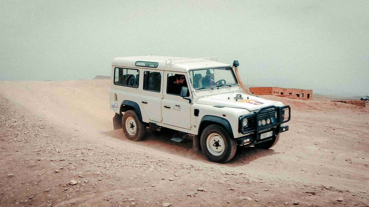 Off Road Vehicle on Dusty Desert Track