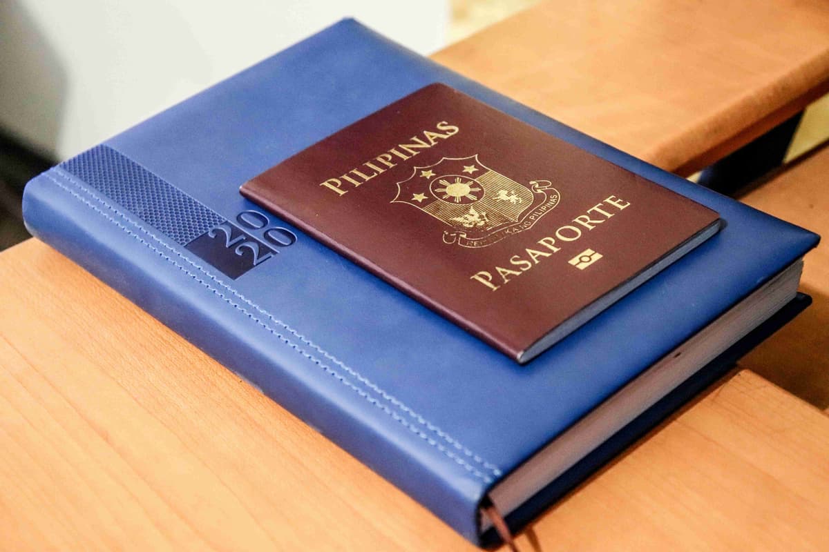 Philippine Passport and Diary on Desk