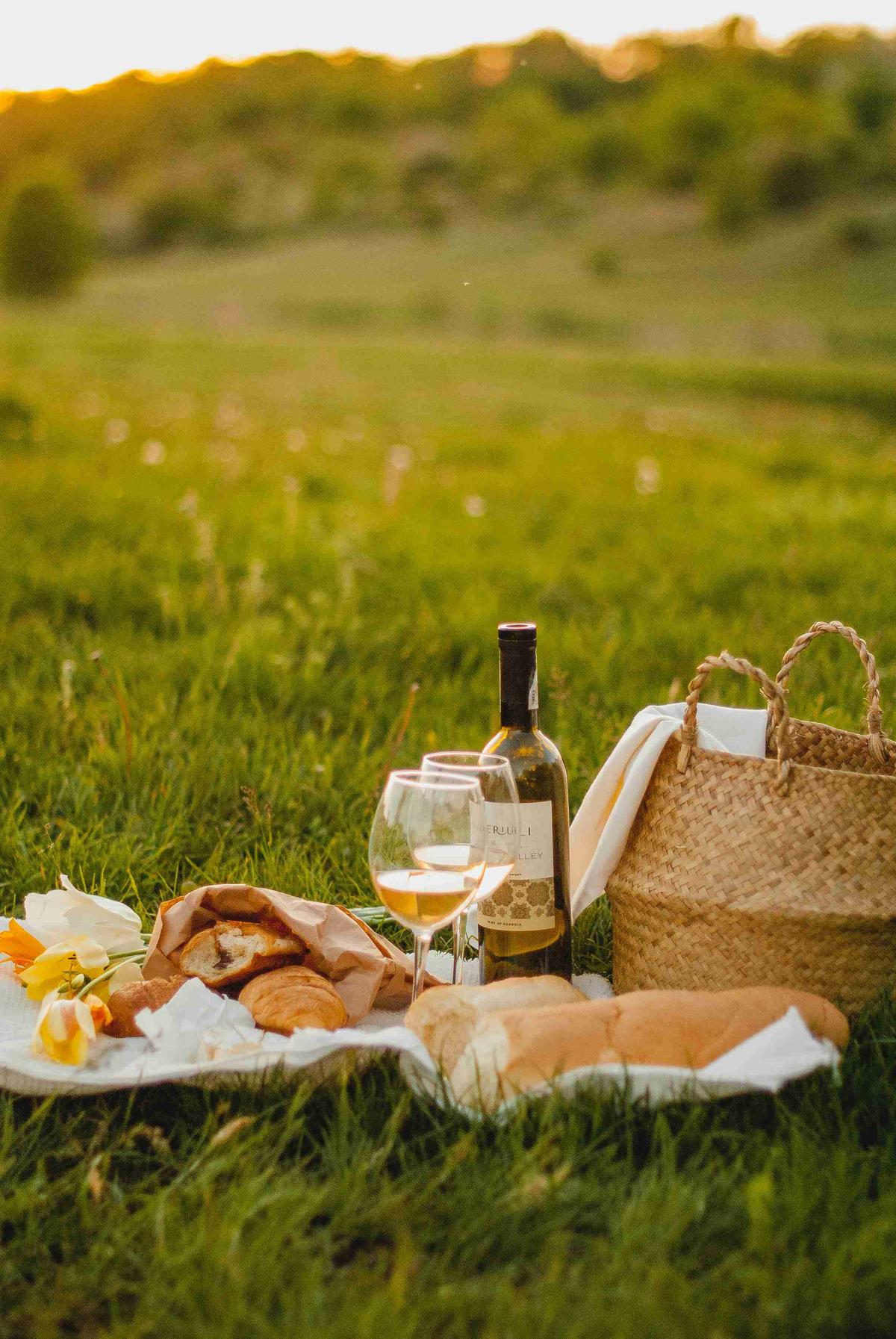 Picnic at Sunset with Wine and Bread