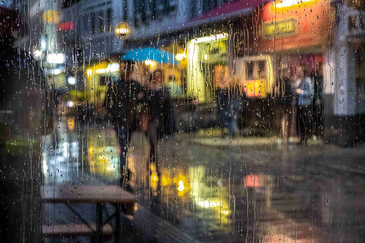 Rainy Cityscape with Pedestrians