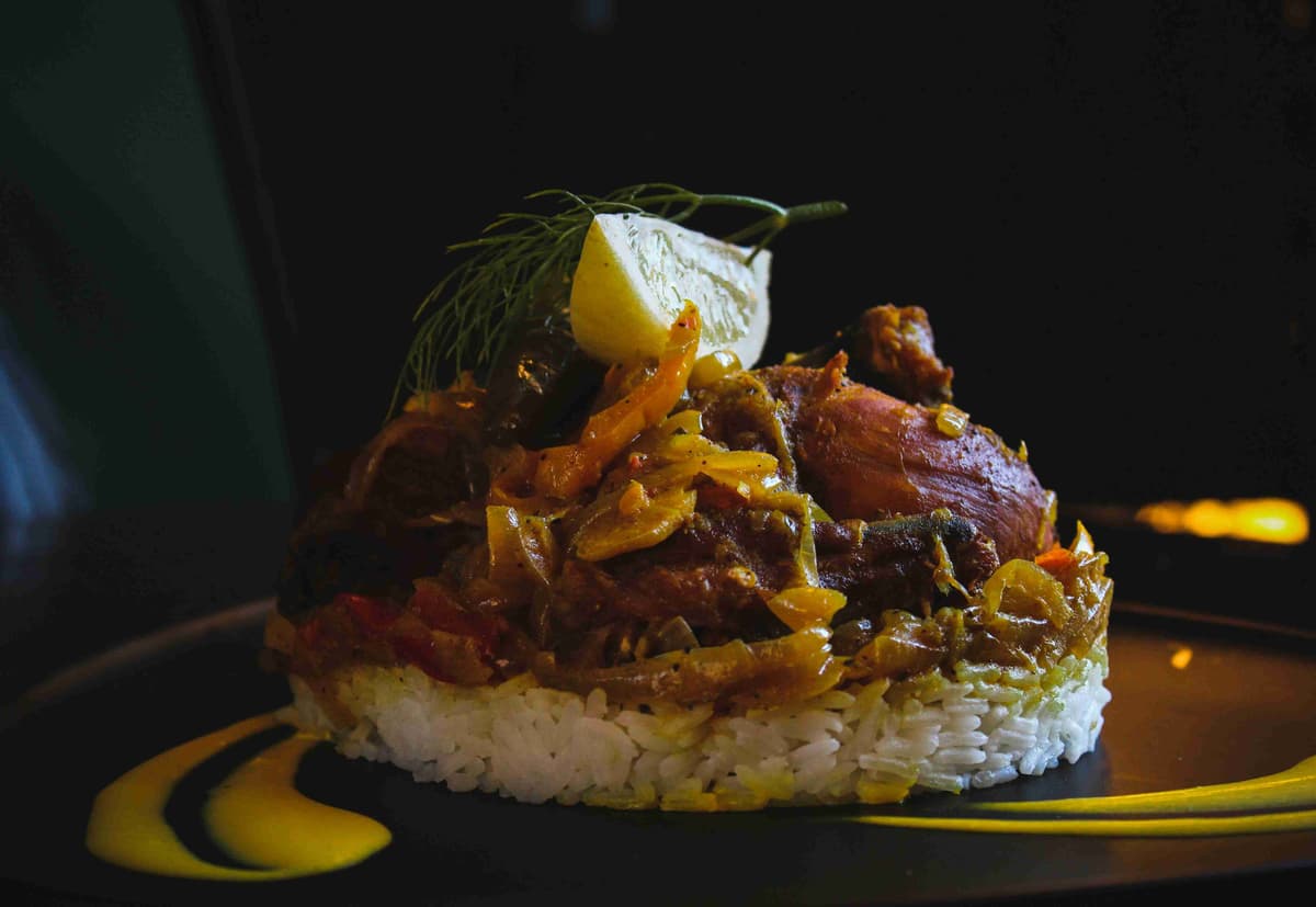 Savory_Lamb_Shank_Over_Rice_with_Lemon Garnish