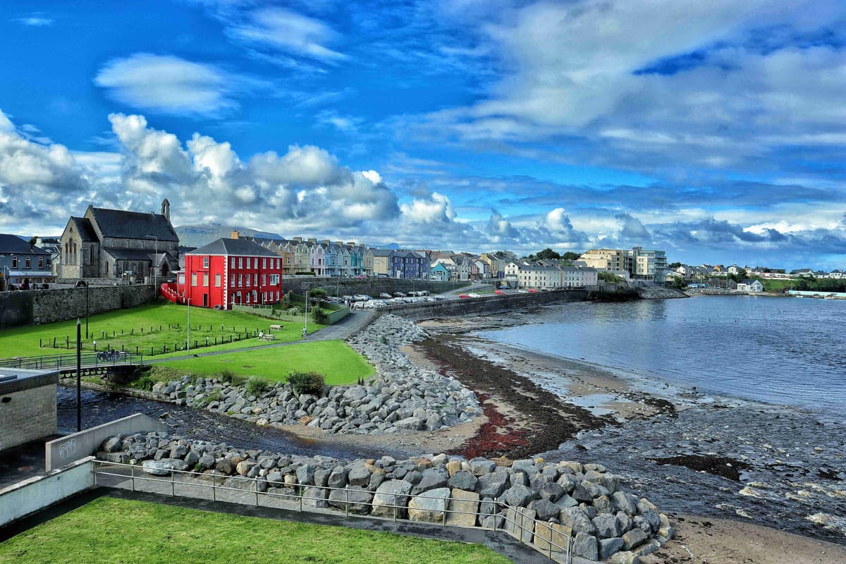 Seaside Town with Historic Architecture and Cloudy Sky