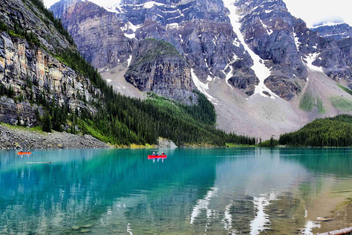 Serene Mountain Lake with Canoes