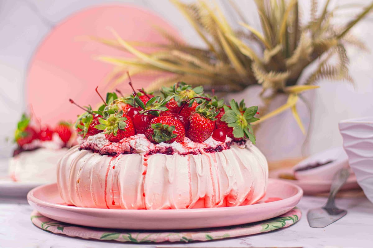 Pavlova with raspberries and whipped cream.