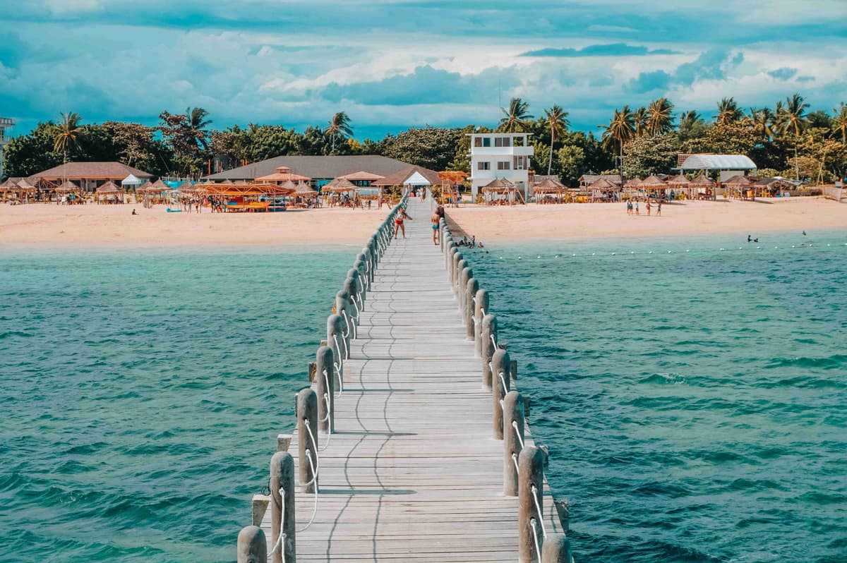 Sunny Tropical Beach Resort with Long Wooden Pier