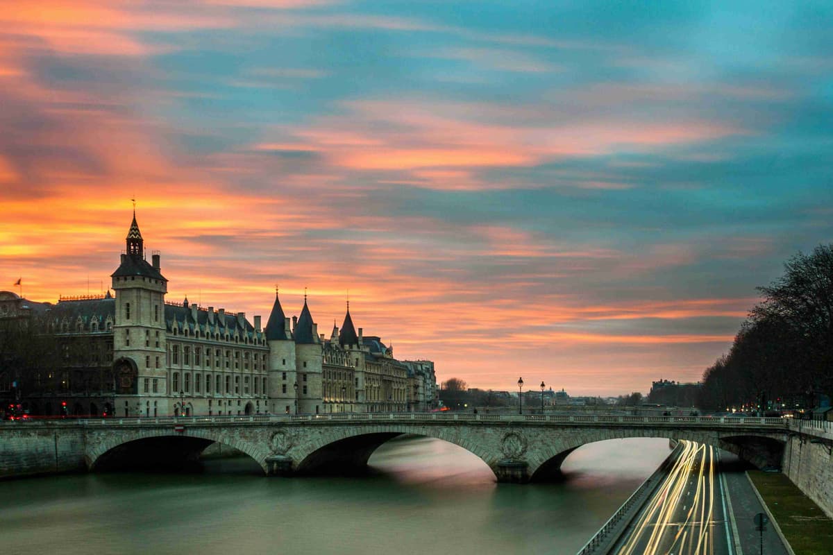 Sunset over Seine River with Conciergerie and Pont au Change Paris