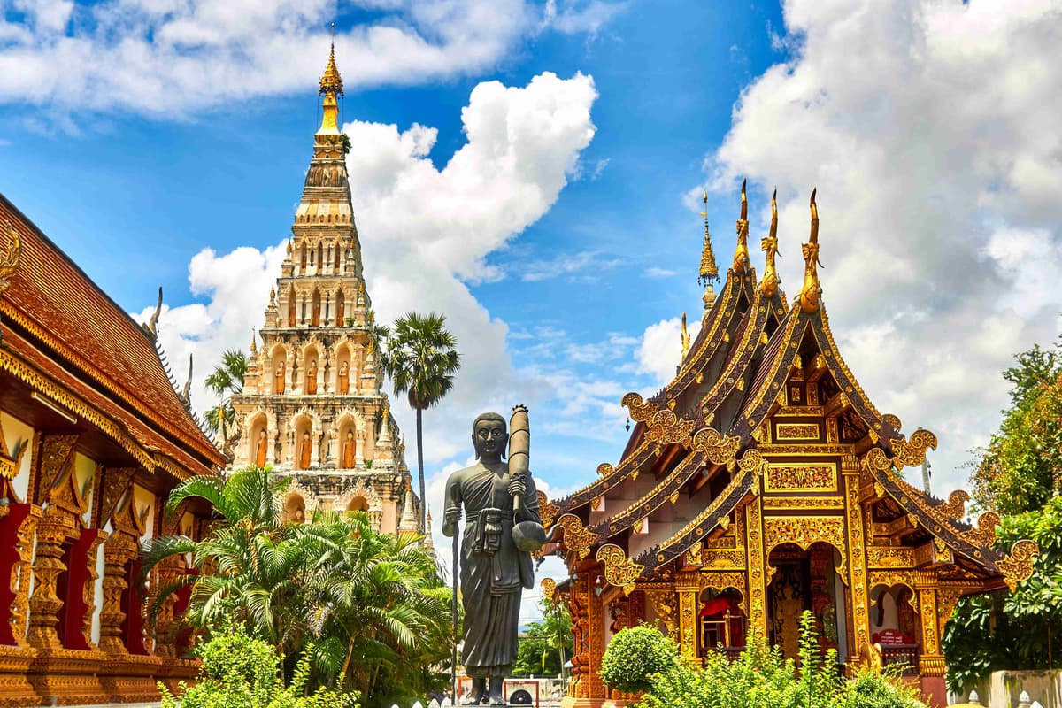 Thai Temple and Stupa Under Blue Sky