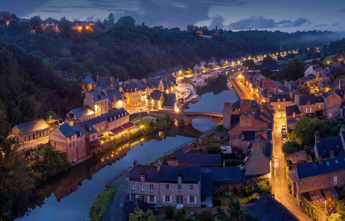 Twilight Over Historic French Village and River