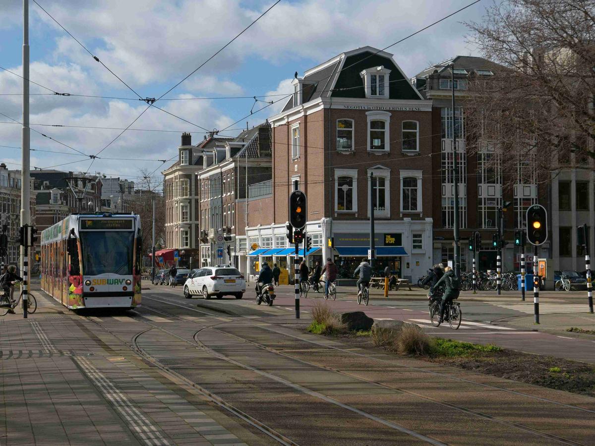 Urban Street Scene with Tram and Cyclists