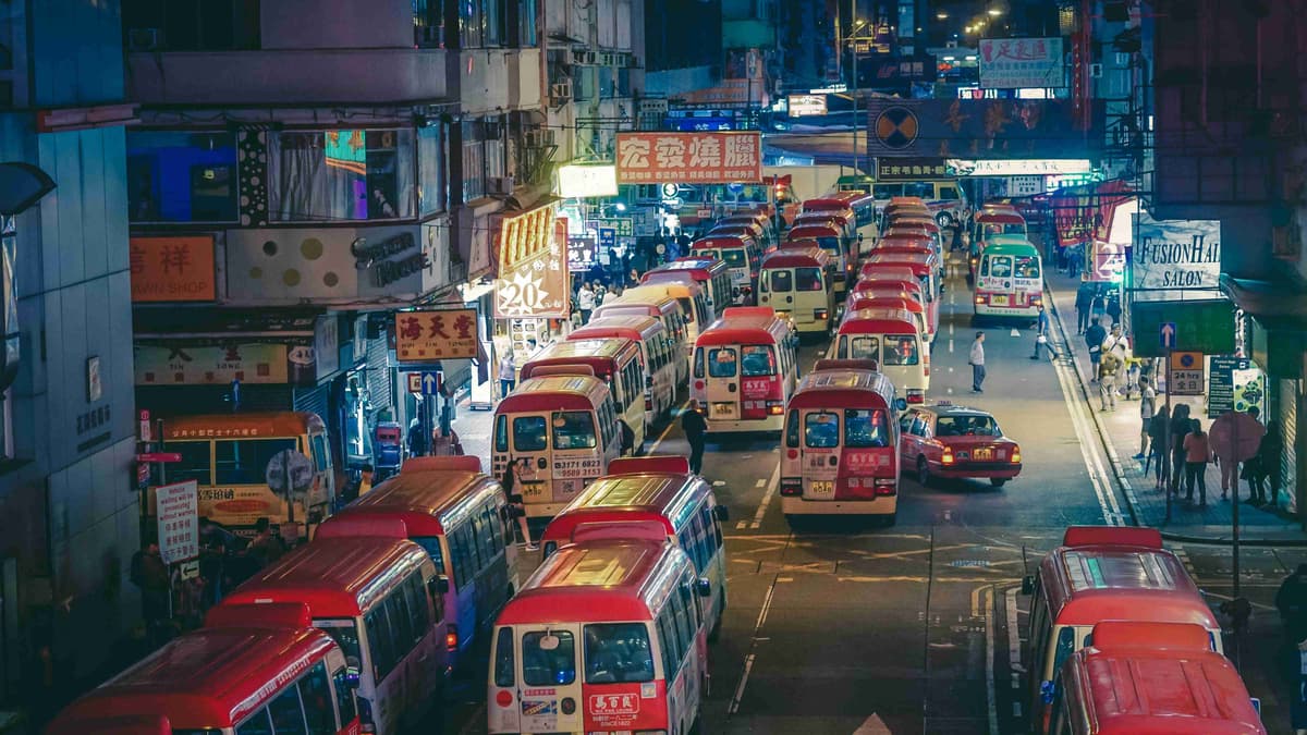 Urban Street with Red Taxis at Night