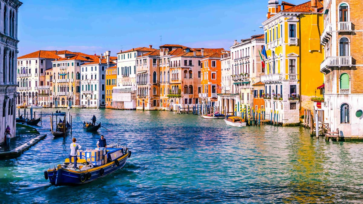 Venetian Canal with Gondolas and Colorful Buildings.