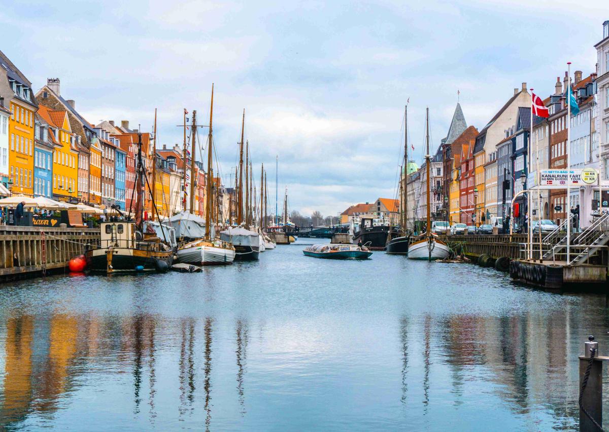 Vibrant Canal Reflections with Sailing Ships