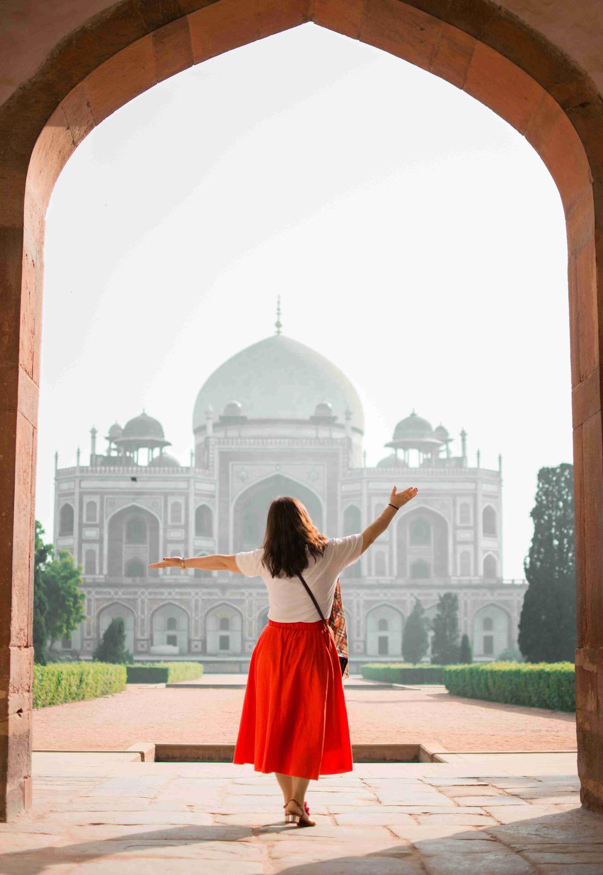 Visitor in Red Skirt at Taj Mahal