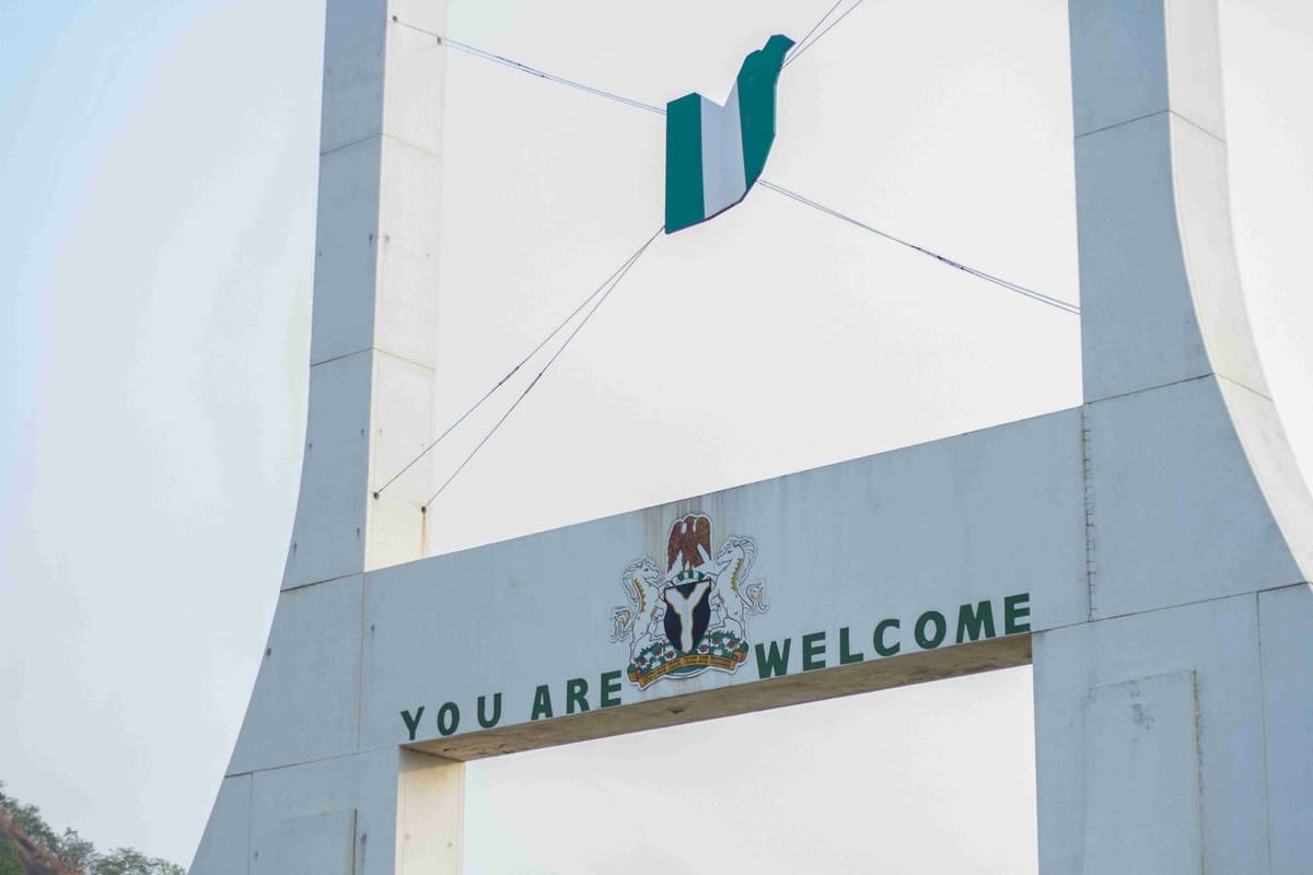 Welcome Sign with Nigerian Flag on Bridge Structure