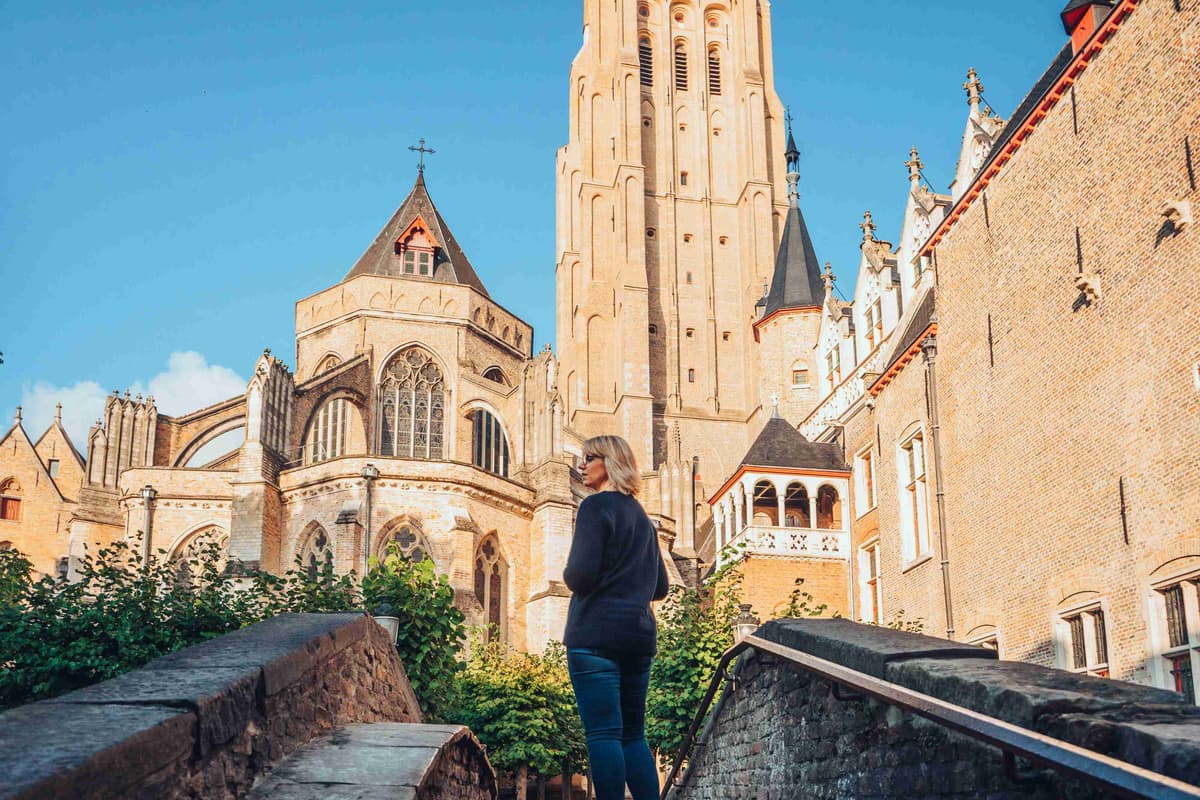 Woman Adoring Historic Gothic Church