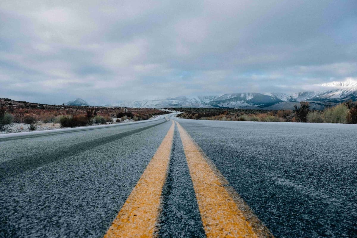 landscape-photography-of-asphalt-road-under-cloudy-sky