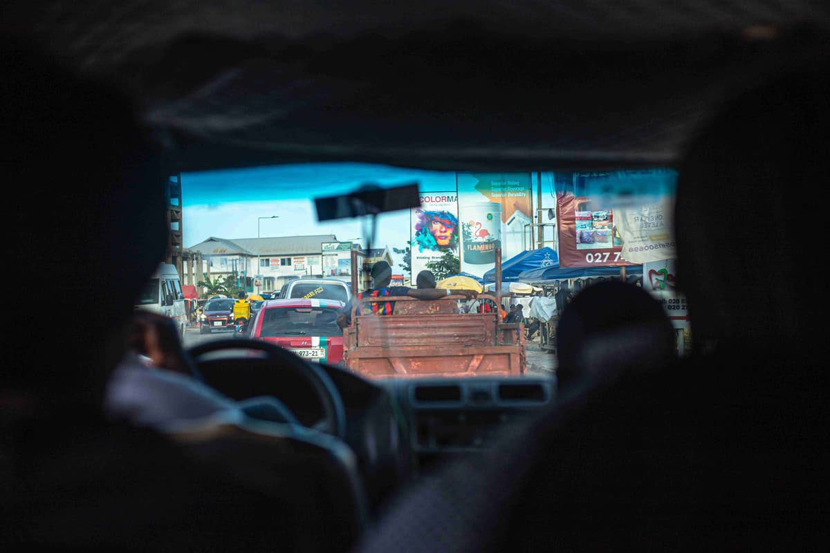 View from inside a car on a busy urban street.