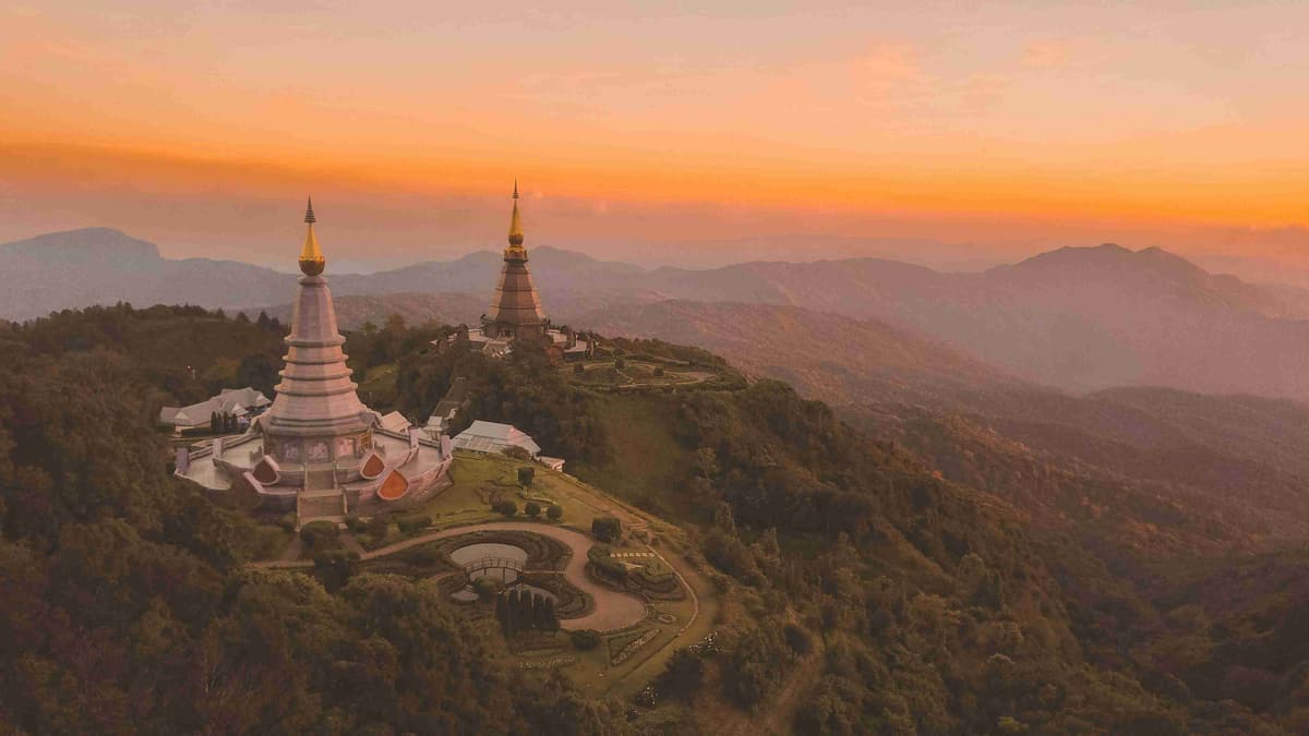 birds-eye-view-of-white-temple-surround-by-trees