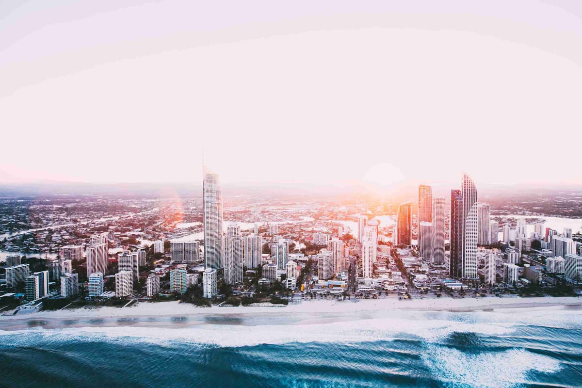 Aerial view of the city of gold coast at sunset.