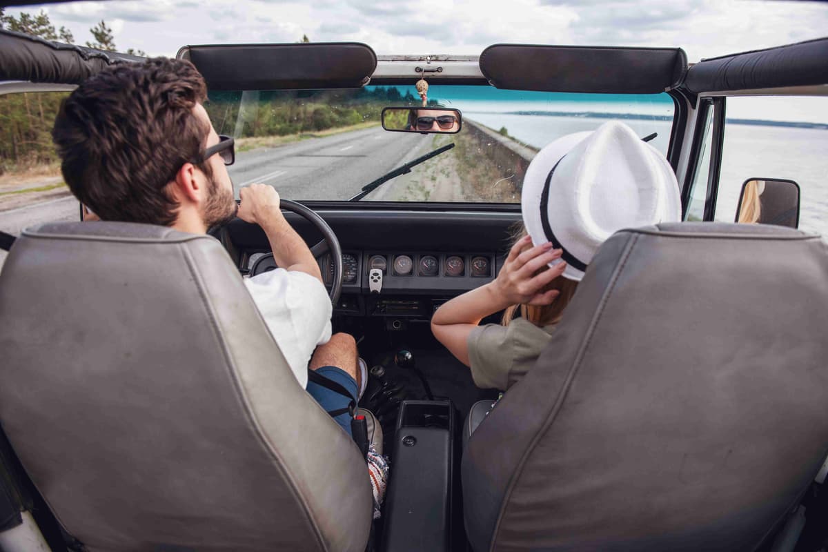 couple-travelling-by-car