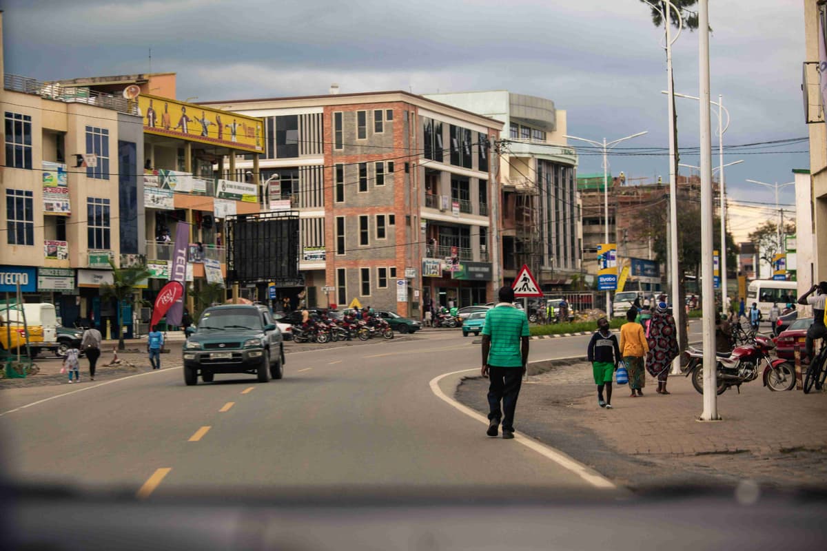 a group of people walking down a street