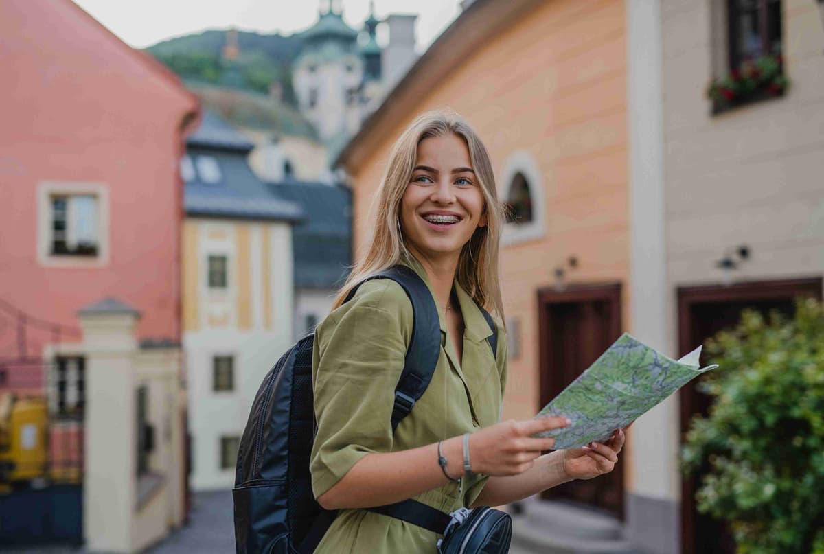 a-happy-young-woman-tourist-outdoors-on-trip