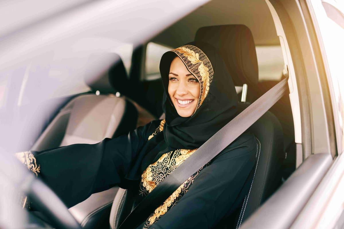 beautiful-muslim-woman-with-toothy-smile-driving-car