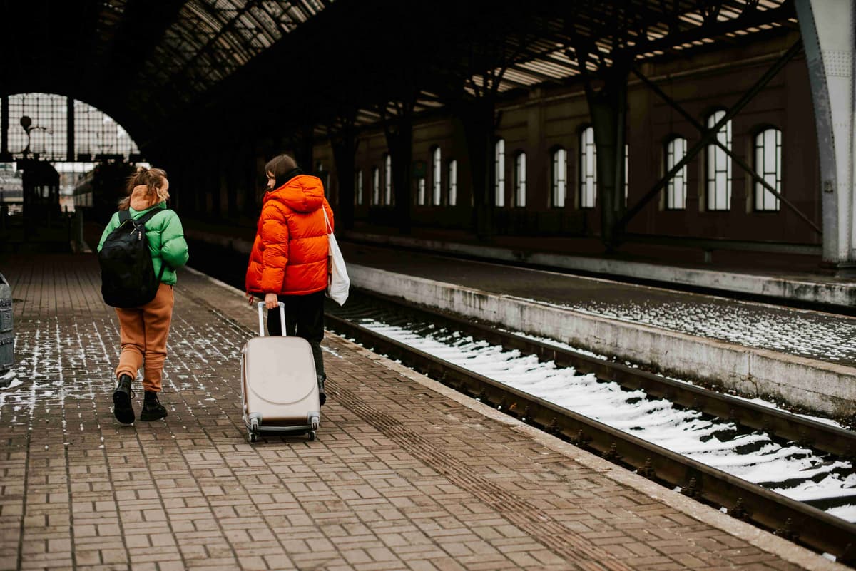 Travelers Walking on a Train Platform in Winter