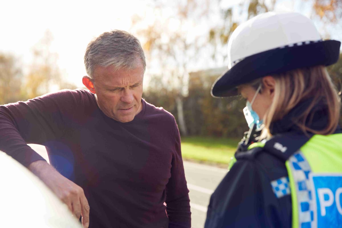 male-driver-being-stopped-by-female-traffic-police